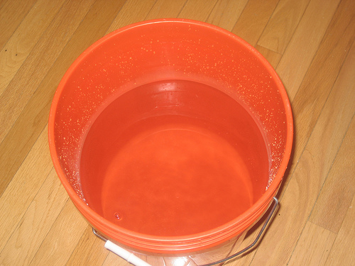 use a bucket or container to dip water out of your aquarium and pour it back in and repeat